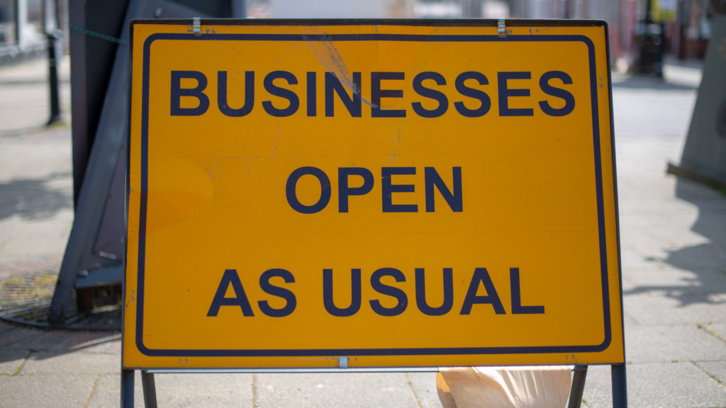 Business Open As Usual Sign